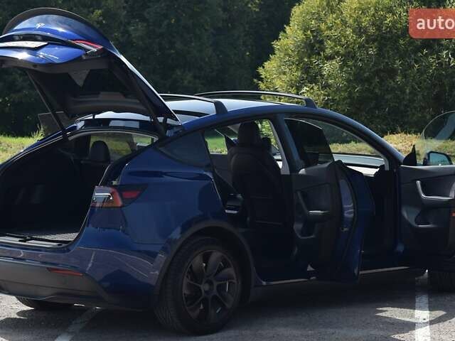 Синий Тесла Model Y, объемом двигателя 0 л и пробегом 81 тыс. км за 25499 $, фото 23 на Automoto.ua