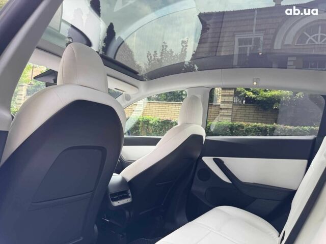 Тесла Model Y 2021 в Киеве на Automoto.ua Синий Тесла Model Y, объемом двигателя 0 л и пробегом 86 тыс. км за 19390 $, фото 20 на Automoto.ua