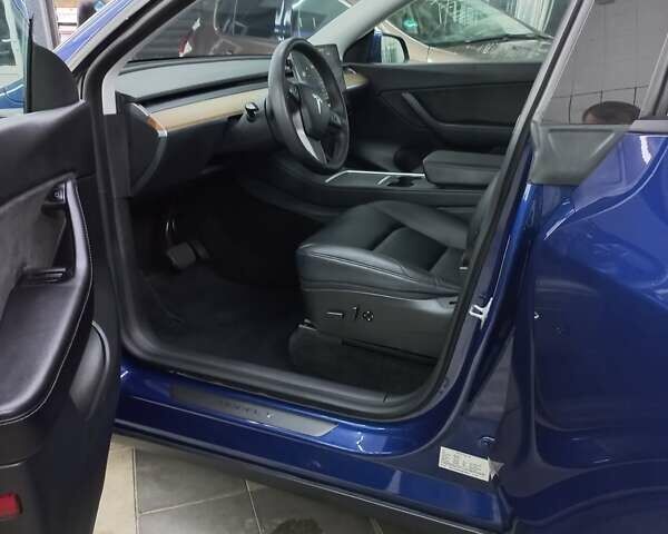 Синий Тесла Model Y, объемом двигателя 0 л и пробегом 91 тыс. км за 25850 $, фото 20 на Automoto.ua