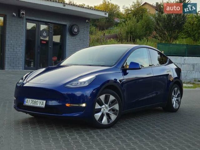 Синий Тесла Model Y, объемом двигателя 0 л и пробегом 99 тыс. км за 25900 $, фото 1 на Automoto.ua