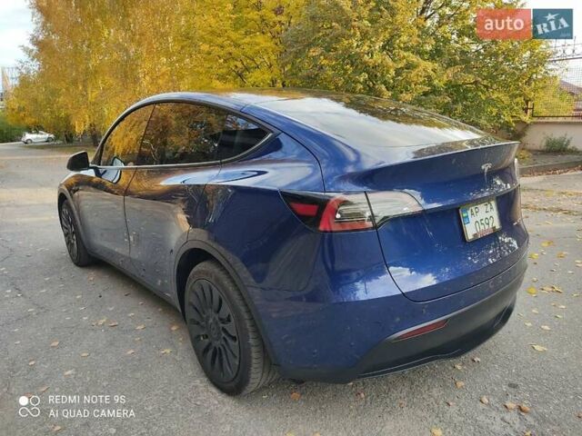 Синий Тесла Model Y, объемом двигателя 0 л и пробегом 58 тыс. км за 24000 $, фото 1 на Automoto.ua