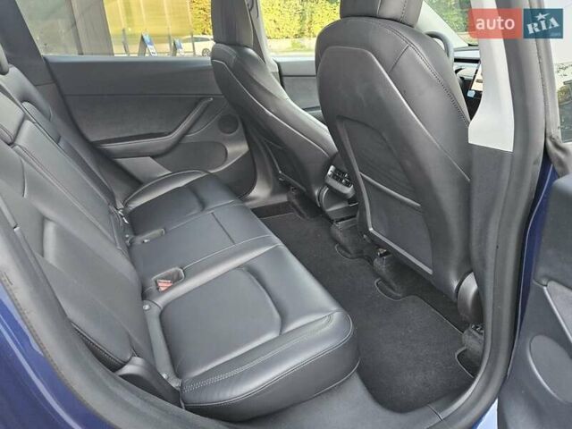 Синий Тесла Model Y, объемом двигателя 0 л и пробегом 99 тыс. км за 26500 $, фото 17 на Automoto.ua