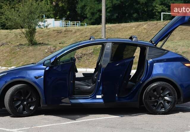 Синий Тесла Model Y, объемом двигателя 0 л и пробегом 81 тыс. км за 25499 $, фото 16 на Automoto.ua