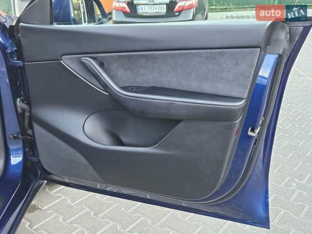 Синий Тесла Model Y, объемом двигателя 0 л и пробегом 99 тыс. км за 26500 $, фото 18 на Automoto.ua