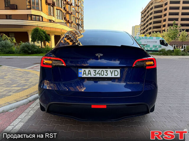 Синий Тесла Model Y, объемом двигателя 0.38 л и пробегом 70 тыс. км за 22000 $, фото 1 на Automoto.ua