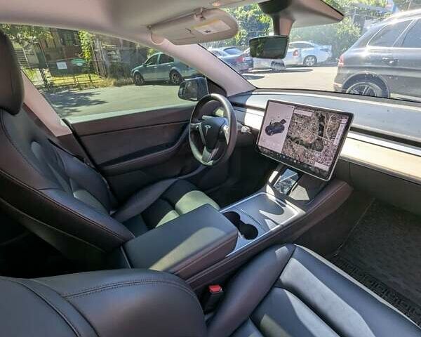 Синий Тесла Model Y, объемом двигателя 0 л и пробегом 84 тыс. км за 28500 $, фото 17 на Automoto.ua