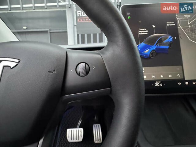 Синий Тесла Model Y, объемом двигателя 0 л и пробегом 88 тыс. км за 31990 $, фото 45 на Automoto.ua
