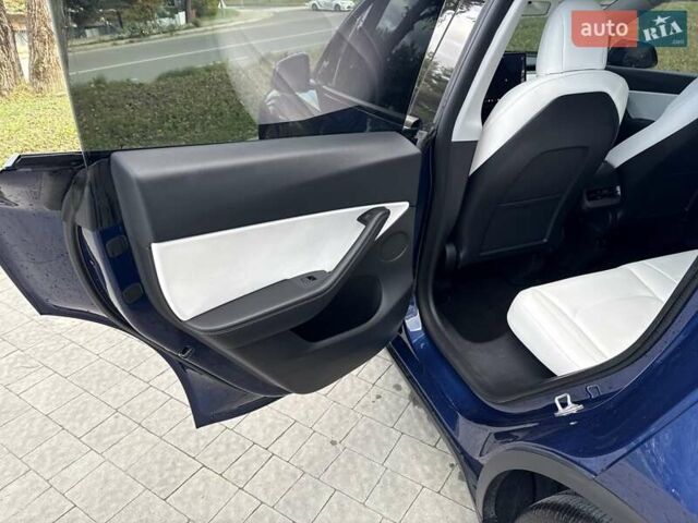 Синій Тесла Model Y, об'ємом двигуна 0 л та пробігом 88 тис. км за 22999 $, фото 37 на Automoto.ua