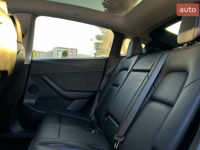 Синий Тесла Model Y, объемом двигателя 0 л и пробегом 72 тыс. км за 25750 $, фото 19 на Automoto.ua