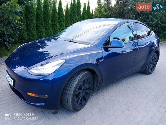 Синий Тесла Model Y, объемом двигателя 0 л и пробегом 69 тыс. км за 24900 $, фото 1 на Automoto.ua