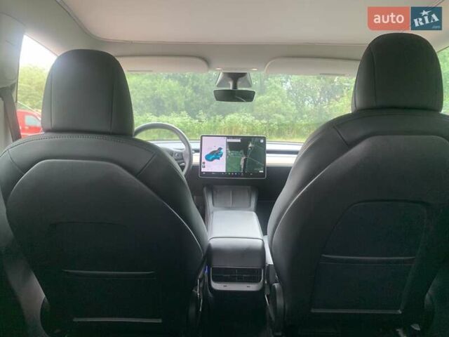 Синий Тесла Model Y, объемом двигателя 0 л и пробегом 75 тыс. км за 22900 $, фото 15 на Automoto.ua