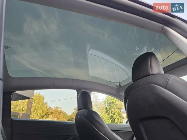 Синий Тесла Model Y, объемом двигателя 0 л и пробегом 99 тыс. км за 26500 $, фото 24 на Automoto.ua