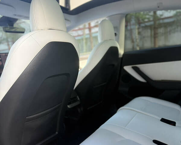 Синий Тесла Model Y, объемом двигателя 0 л и пробегом 97 тыс. км за 26500 $, фото 18 на Automoto.ua