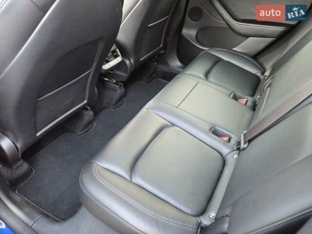 Синий Тесла Model Y, объемом двигателя 0 л и пробегом 99 тыс. км за 26500 $, фото 27 на Automoto.ua