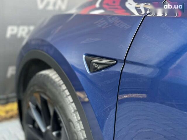 Синий Тесла Model Y, объемом двигателя 0 л и пробегом 83 тыс. км за 28000 $, фото 17 на Automoto.ua