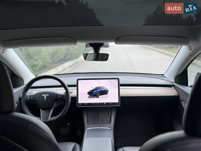 Синий Тесла Model Y, объемом двигателя 0 л и пробегом 52 тыс. км за 30900 $, фото 30 на Automoto.ua