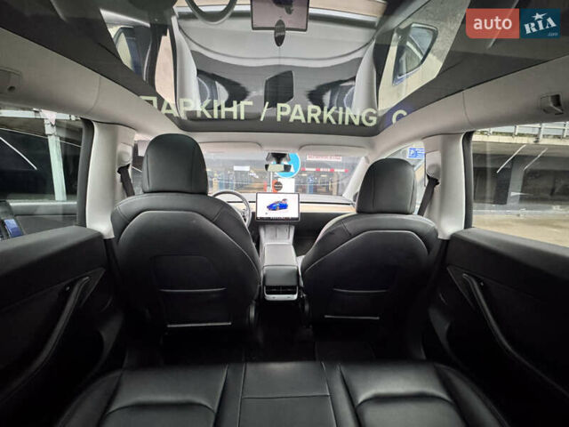 Синий Тесла Model Y, объемом двигателя 0 л и пробегом 104 тыс. км за 22900 $, фото 3 на Automoto.ua