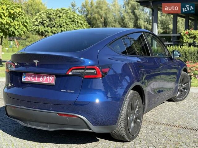 Синий Тесла Model Y, объемом двигателя 0 л и пробегом 80 тыс. км за 25300 $, фото 56 на Automoto.ua