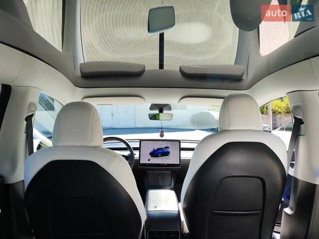 Синий Тесла Model Y, объемом двигателя 0 л и пробегом 63 тыс. км за 26800 $, фото 4 на Automoto.ua