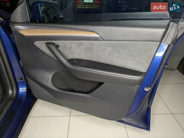 Синий Тесла Model Y, объемом двигателя 0 л и пробегом 51 тыс. км за 30900 $, фото 39 на Automoto.ua