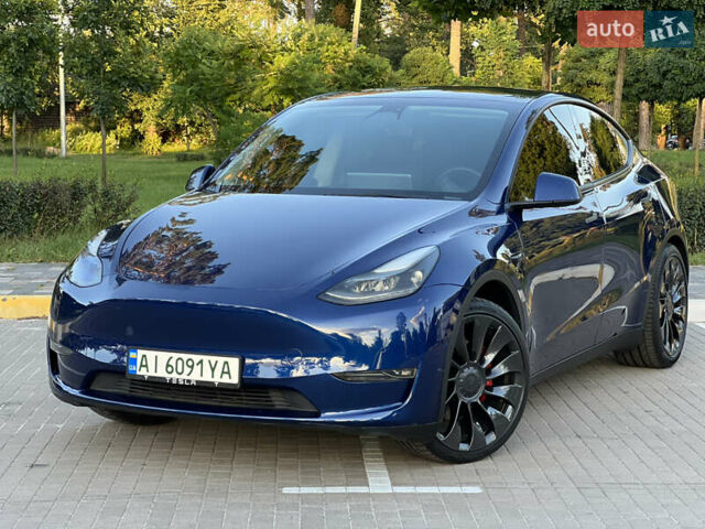 Синий Тесла Model Y, объемом двигателя 0 л и пробегом 84 тыс. км за 26900 $, фото 1 на Automoto.ua