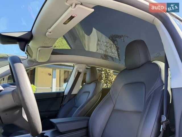 Синий Тесла Model Y, объемом двигателя 0 л и пробегом 80 тыс. км за 25300 $, фото 78 на Automoto.ua
