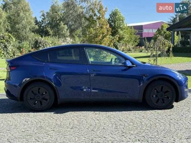 Синий Тесла Model Y, объемом двигателя 0 л и пробегом 80 тыс. км за 25300 $, фото 41 на Automoto.ua