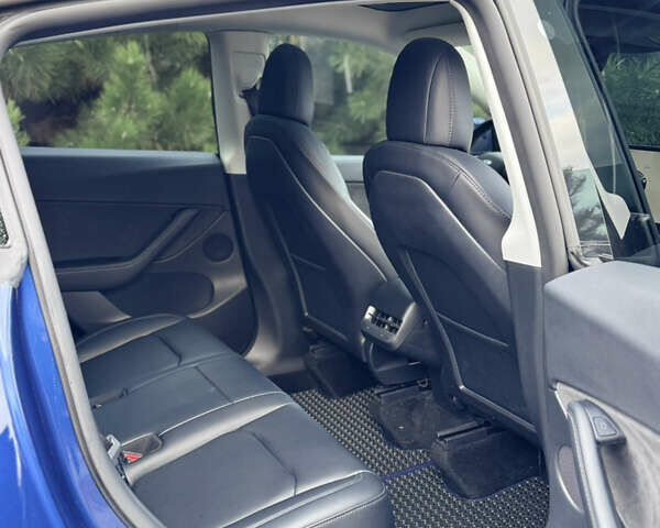 Синий Тесла Model Y, объемом двигателя 0 л и пробегом 52 тыс. км за 30900 $, фото 25 на Automoto.ua
