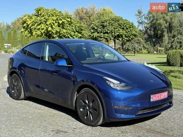 Синий Тесла Model Y, объемом двигателя 0 л и пробегом 80 тыс. км за 25300 $, фото 1 на Automoto.ua