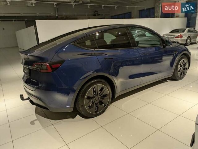 Синий Тесла Model Y, объемом двигателя 0 л и пробегом 51 тыс. км за 30900 $, фото 9 на Automoto.ua