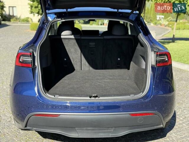 Синий Тесла Model Y, объемом двигателя 0 л и пробегом 80 тыс. км за 25300 $, фото 63 на Automoto.ua