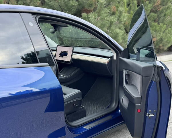Синий Тесла Model Y, объемом двигателя 0 л и пробегом 52 тыс. км за 30900 $, фото 35 на Automoto.ua