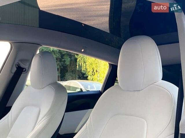 Синий Тесла Model Y, объемом двигателя 0 л и пробегом 92 тыс. км за 31999 $, фото 13 на Automoto.ua