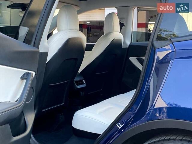 Синий Тесла Model Y, объемом двигателя 0 л и пробегом 92 тыс. км за 31999 $, фото 14 на Automoto.ua
