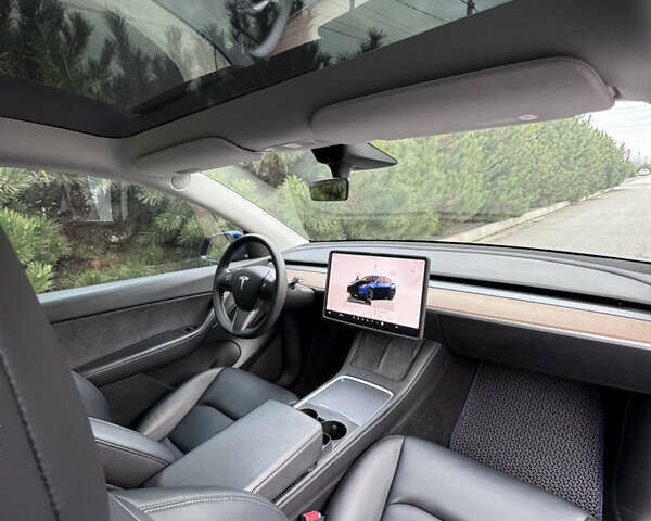 Синий Тесла Model Y, объемом двигателя 0 л и пробегом 52 тыс. км за 30900 $, фото 26 на Automoto.ua