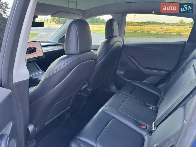 Синий Тесла Model Y, объемом двигателя 0 л и пробегом 61 тыс. км за 23800 $, фото 11 на Automoto.ua