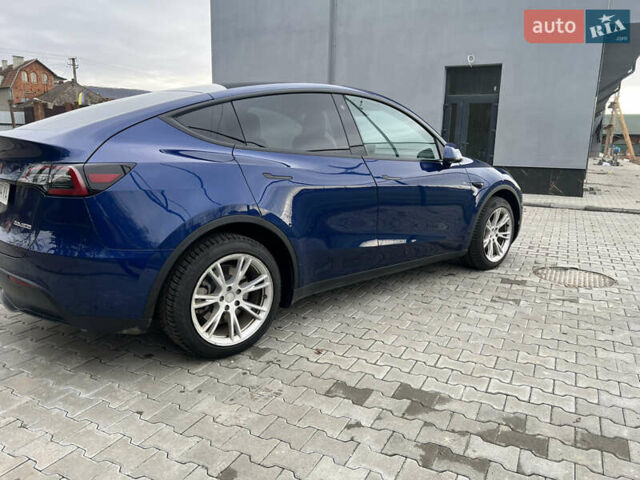 Синий Тесла Model Y, объемом двигателя 0 л и пробегом 86 тыс. км за 24900 $, фото 3 на Automoto.ua
