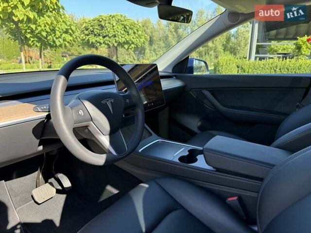 Синий Тесла Model Y, объемом двигателя 0 л и пробегом 80 тыс. км за 25300 $, фото 76 на Automoto.ua