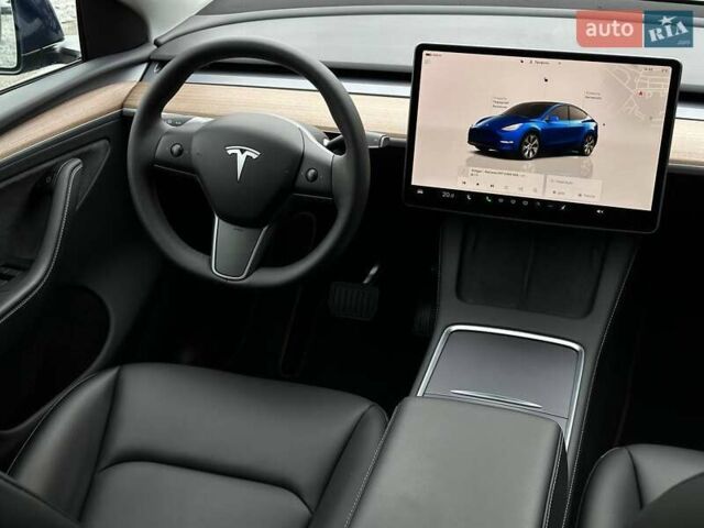 Синий Тесла Model Y, объемом двигателя 0 л и пробегом 10 тыс. км за 30494 $, фото 74 на Automoto.ua