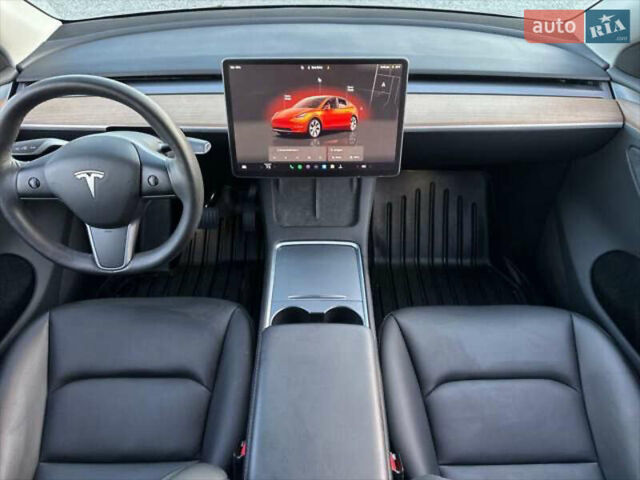 Синий Тесла Model Y, объемом двигателя 0 л и пробегом 22 тыс. км за 26000 $, фото 3 на Automoto.ua