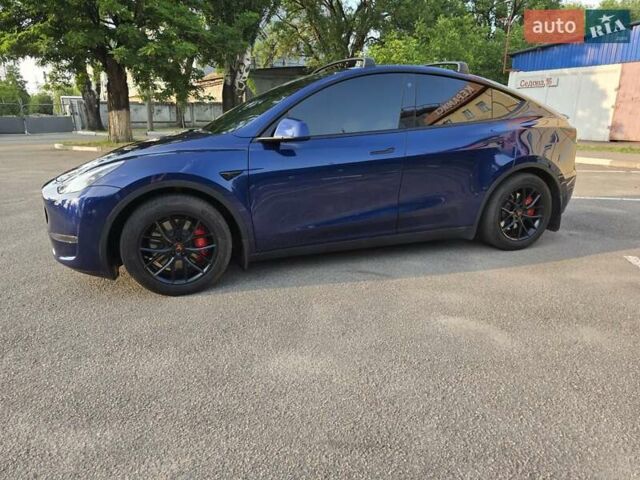 Синий Тесла Model Y, объемом двигателя 0 л и пробегом 51 тыс. км за 26400 $, фото 1 на Automoto.ua