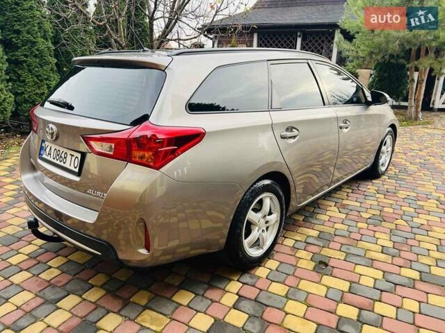 Коричневий Тойота Ауріс, об'ємом двигуна 1.36 л та пробігом 196 тис. км за 8999 $, фото 7 на Automoto.ua