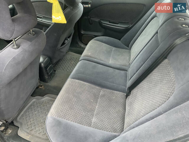 Белый Тойота Авенсис, объемом двигателя 2 л и пробегом 250 тыс. км за 3600 $, фото 7 на Automoto.ua