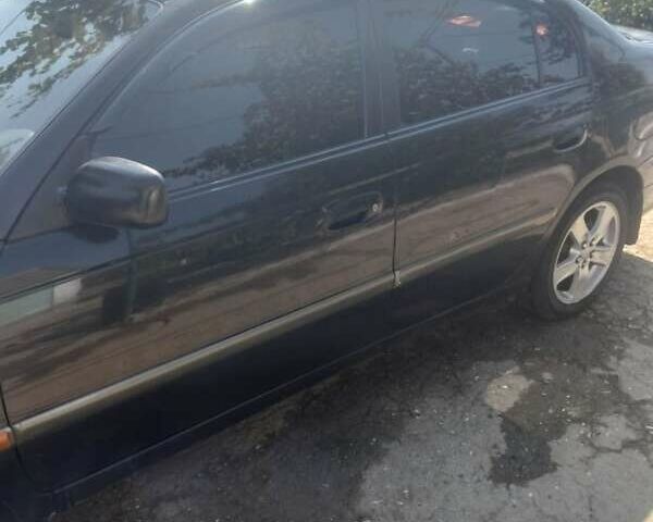 Черный Тойота Авенсис, объемом двигателя 2 л и пробегом 300 тыс. км за 3600 $, фото 5 на Automoto.ua