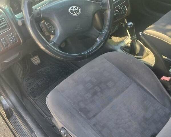 Черный Тойота Авенсис, объемом двигателя 2 л и пробегом 300 тыс. км за 3600 $, фото 1 на Automoto.ua