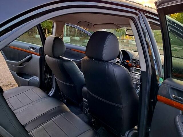 Черный Тойота Авенсис, объемом двигателя 1.8 л и пробегом 183 тыс. км за 7500 $, фото 10 на Automoto.ua