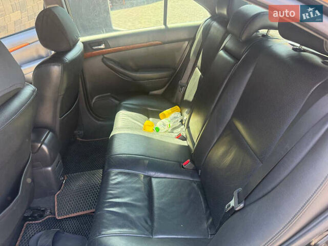 Чорний Тойота Авенсіс, об'ємом двигуна 2 л та пробігом 210 тис. км за 7500 $, фото 6 на Automoto.ua