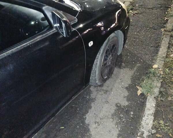 Черный Тойота Авенсис, объемом двигателя 2 л и пробегом 237 тыс. км за 2500 $, фото 3 на Automoto.ua