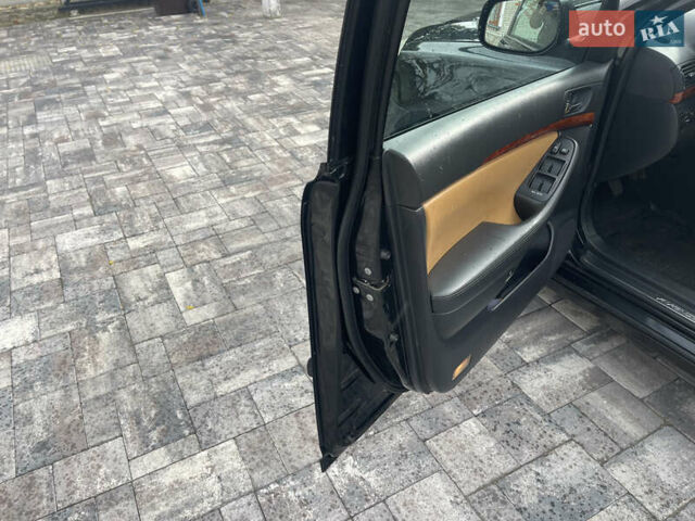 Черный Тойота Авенсис, объемом двигателя 2 л и пробегом 300 тыс. км за 6999 $, фото 22 на Automoto.ua
