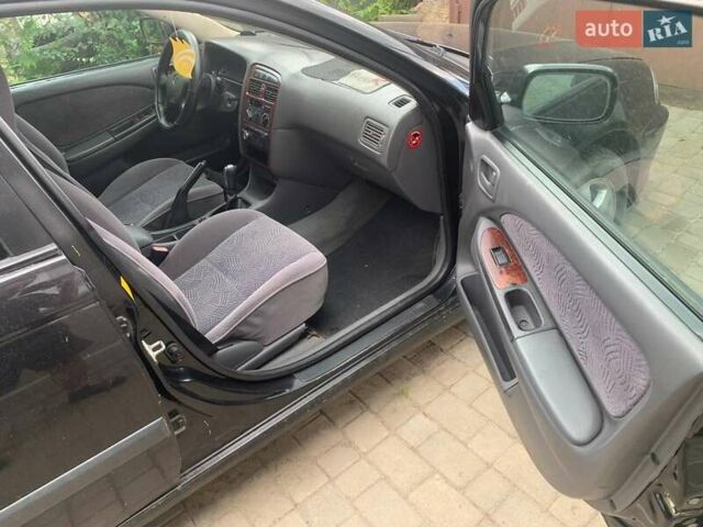 Черный Тойота Авенсис, объемом двигателя 1.76 л и пробегом 417 тыс. км за 2800 $, фото 5 на Automoto.ua